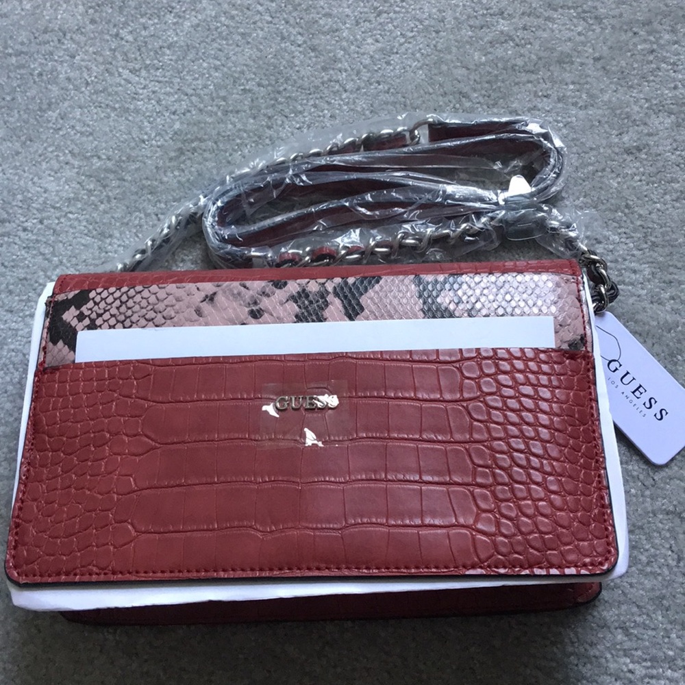 Dark red snake print GUESS crossbody bag
